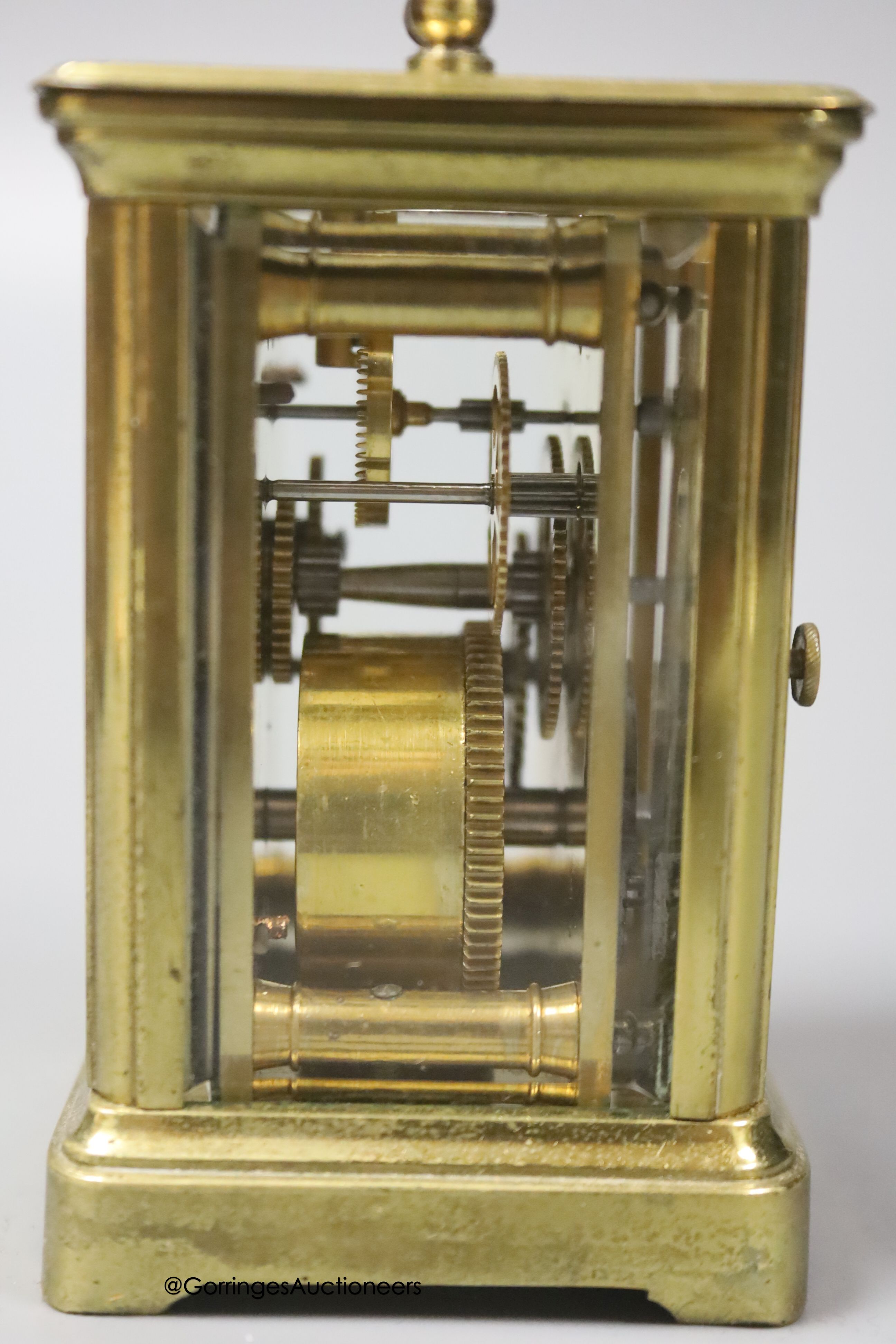 A brass cased carriage timepiece, 7.5cm, in a leather carrying case